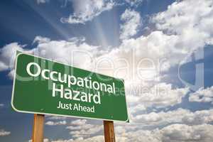Occupational Hazard Green Road Sign Over Clouds