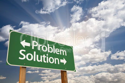 Problem and Solution Green Road Sign Over Clouds