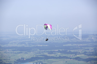 Paragliders flying over Bavarian mountains