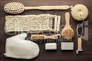 some bath accessories on brown wooden background