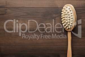 wooden massager brush on the table