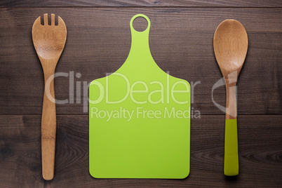 wooden spoon and cutting board on the table