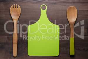 wooden spoon and cutting board on the table