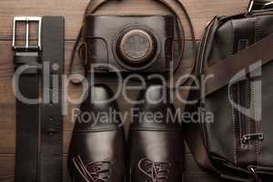brown shoes, belt, bag and film camera