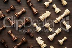 chess figures on brown wooden table background