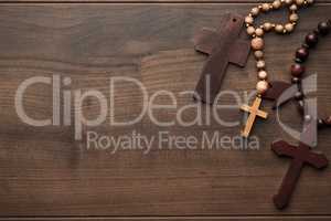 crosses over brown wooden background