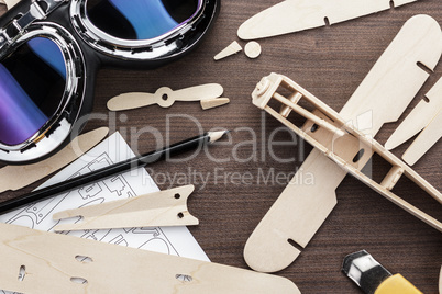 handmade airplane on brown wooden table