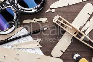 handmade airplane on brown wooden table