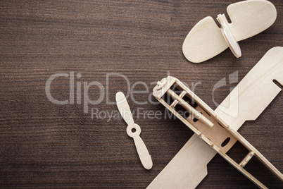 handmade airplane on brown wooden table