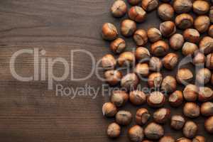 hazelnuts on the brown wooden table