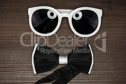 bow tie and sunglasses on the table