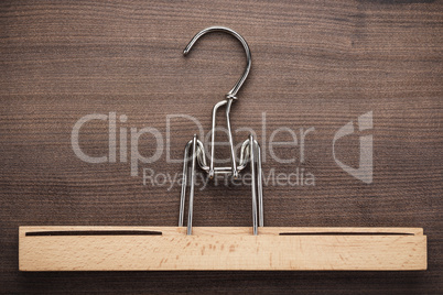 clothing hanger on brown table
