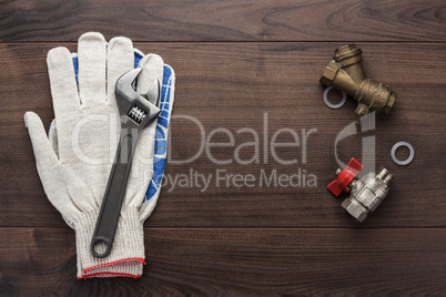 adjustable wrench gloves and pipes