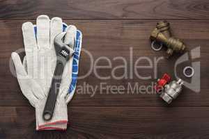 adjustable wrench gloves and pipes
