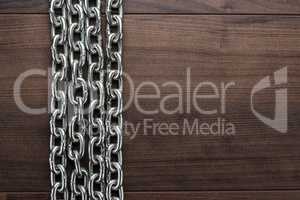 big chains on the wooden background