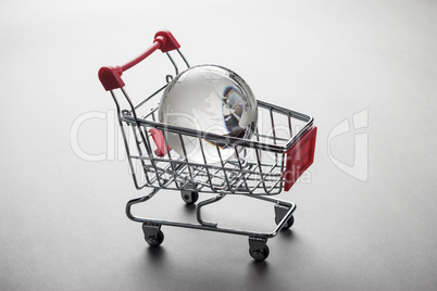 glass globe in the shopping trolley concept