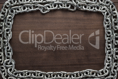 chain frame on the wooden background