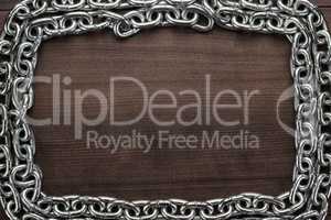 chain frame on the wooden background