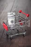 a hundred dollars in the shopping trolley