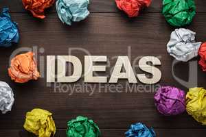word idea and crumpled colorful paper