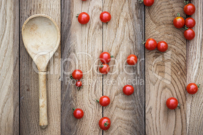 cherry tomatoes and wooden spoon