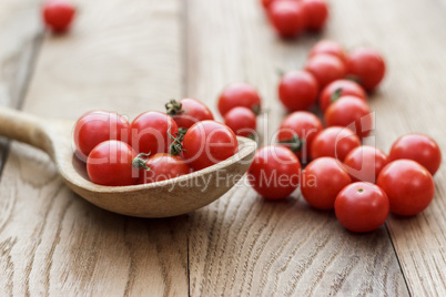 cherry tomatoes and wooden spoon