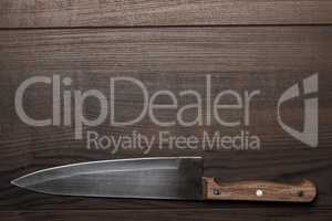 kitchen knife on brown wooden table