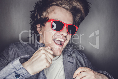closeup portrait of a casual young man with sunglasses