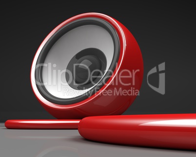 red speaker with cable over grey background