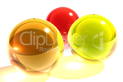 3 glass spheres. red. orange. yellow