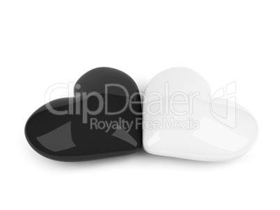 black and white hearts lying on the white background