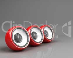 three red speakers over grey