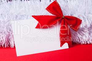 blank christmas greeting card with red bow
