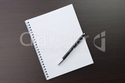 blank notebook and pen on the table