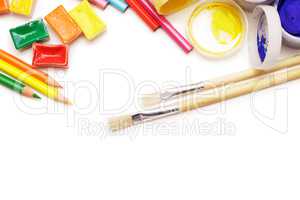 different artist's instruments over white background