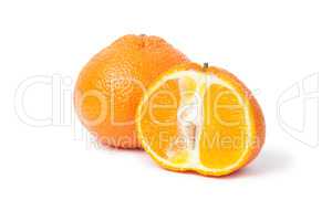 fresh mandarin and a half isolated on white