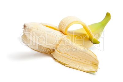 half peeled banana isolated on the white background