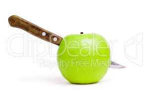 knife in the apple over white background