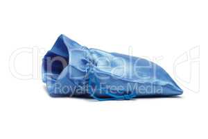 opened blue christmas bag with present isolated over white backg