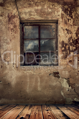 room in an old abandoned house with grunge wall and wooden floor