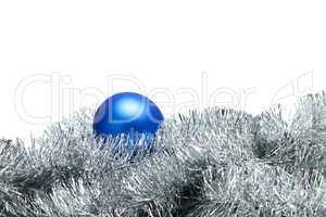 blue christmas ball with tinsel isolated on white