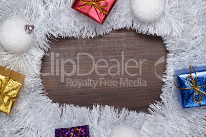 gifts and christmas decoration on wooden background