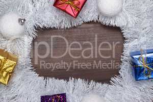 gifts and christmas decoration on wooden background