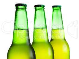 green beer bottles isolated over white