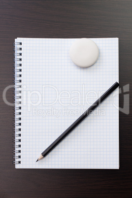 blank notebook and pen on the table