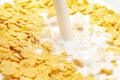 milk splashing into cornflakes