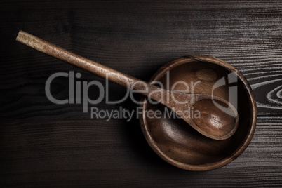 salad bowl and spoon on brown table