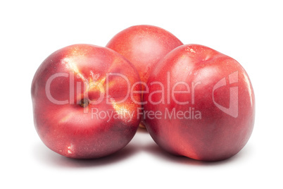 three ripe nectarines isolated on white background