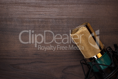 vintage condensing microphone on the wooden background