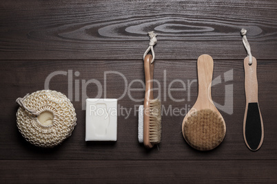 bath accessories on the brown wooden background
